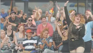  ??  ?? The audience cheers drag queen Victoria Adams at Ocean Beach Park during the Pride at the Beach Festival organized by OutCT.