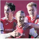  ?? Phil Mingo/PPAUK ?? > Matt Jay celebrates his goal with Josh Key and Jack Sparkes