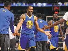  ?? Doug Pensinger / Getty Images ?? Super-sub Andre Iguodala and the rest of the Warriors are enjoying a magical run of 15 straight wins to start the season.