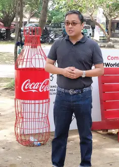  ??  ?? COCA-Cola corporate and regulatory affairs director, Atty. Juan Lorenzo Tañada