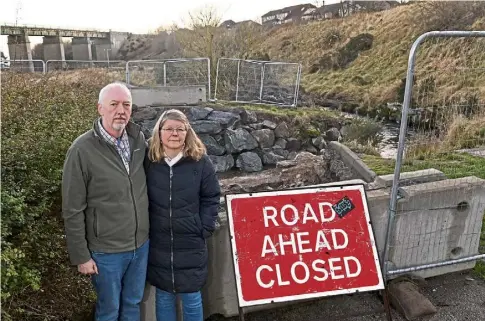  ?? Picture by Darrell Benns. ?? WORRIED: Garry and Annie Barclay near the bridge that was removed before Storm Babet.