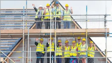  ??  ?? The topping out ceremony at Chamberlai­n Manor in Ashford