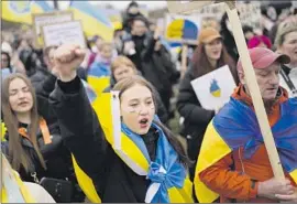  ?? Markus Schreiber Associated Press ?? A CROWD in Berlin protests the war in Ukraine. Russian immigrants in Germany are seeing their businesses boycotted and have even received threats.