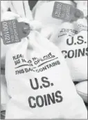  ??  ?? UNSEARCHED: Pictured above are the unsearched Vault Bags loaded with nearly 3 pounds of U.S. Gov’t issued coins some dating back to the 1800’s being handed over to Texas residents by Federated Mint.