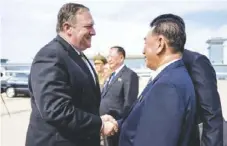  ??  ?? American Secretary of State Mike Pompeo (left) and North Korea’s ruling party vice chairman Kim Yong- chol say goodbye as the former departs for Japan.