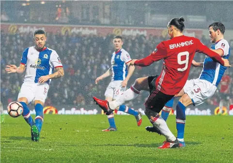  ?? REUTERS ?? Manchester United’s Zlatan Ibrahimovi­c scores the winning goal against Blackburn Rovers.