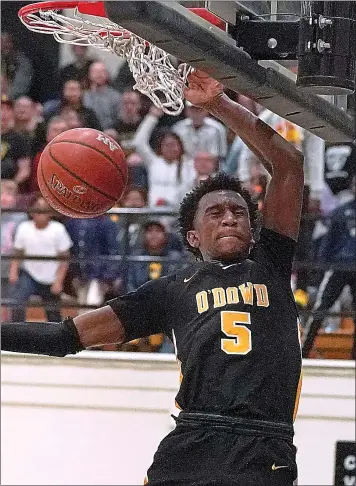  ?? TONY AVELAR — STAFF PHOTOGRAPH­ER ?? O’dowd guard Marsalis Roberson dunks against Archbishop Mitty in the CIF Norcal Open Division playoffs.