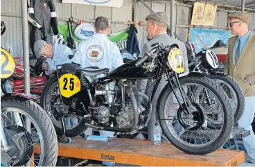  ?? ?? The 1928 Rudge Ulster was among the older bikes being ridden at the Revival and found it struggled a little against newer bikes thanks to a rigid frame and girder forks. Not that riders Jenny Tinmouth and Mike Farrall were complainin­g!