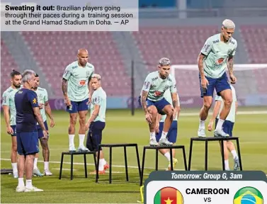  ?? ?? Sweating it out: brazilian players going through their paces during a training session at the Grand Hamad Stadium in doha. — ap