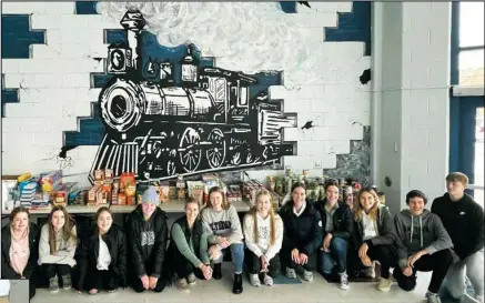  ?? ?? VCHS students pictured above l-r: Carter Hass, Alyssa Wilmes, Abby Shanenko, Abby Wilmes, Jessa Koch, Alyssa Thomsen, Hadley Thoreson, Jovi Borg, Greta Goven, Carly Goven, Sydnee Ingstad, Jayden Johnson, Adon Berntson
LEFT: Students don’t let a little ice or snow stop them from helping out their local food pantry, loading up a hefty helping of donated food to help stock the Barnes County Food Pantry. With food costs rising, every little bit helps your local pantries -- consider donating today.
