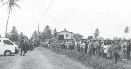  ??  ?? Residents gathered outside of the property as police searched for the suspected remains of Lilwantie Balack