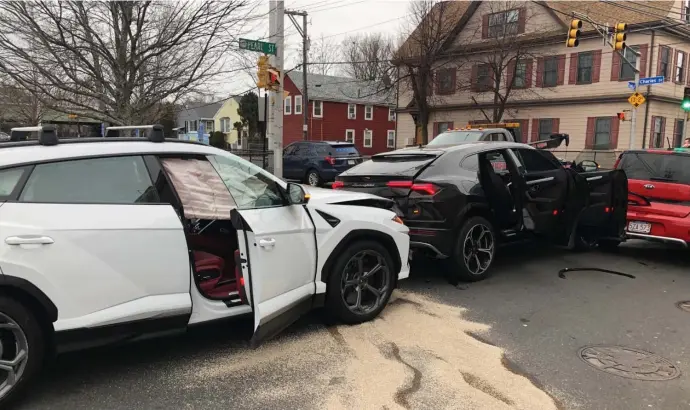  ?? PHOTO COURTESY OF WCVB-TV ?? STRIKING VEHICLES: Two Lamborghin­i Urus SUVs are seen after a collision Tuesday at Pearl and Charles streets in Malden.