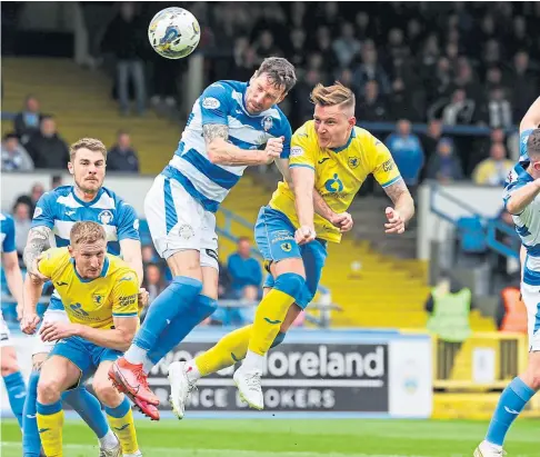  ?? ?? STILL REASONS FOR OPTIMISM: Euan Murray gets in front of Kirk Broadfoot to power in a header against Morton.