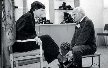  ??  ?? David Robertson fitting former prime minister Helen Clark. The Robertson family have been in the footwear business for 70 years with Mervyn Adams, Kumfs and most recently Ziera.