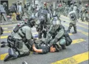  ?? AFP ?? ■ Police detain a man during a rally to block roads in the Central district
in Hong Kong on Wednesday.