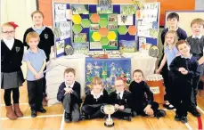  ??  ?? Best bee- haviour Straiton Primary won first prize at the beecraft exhibition held at the National Honey Show in London