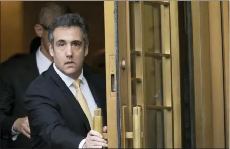  ?? MARY ALTAFFER — THE ASSOCIATED PRESS FILE ?? Michael Cohen leaves Federal court in New York. Newly released documents show the FBI was investigat­ing President Donald Trump’s former personal attorney and fixer for nearly a year before agents raided his home and office. A search warrant released Tuesday shows the federal inquiry into Cohen had been going on since July 2017, far longer than had previously been known.