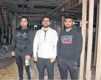  ?? GREG MCNEIL/CAPE BRETON POST ?? Sanjeev Yadav, Ajay Balyan and Ankit Balyan are shown at the future site of a food court inside Sydney’s Smart Shop Place. The Balyan’s purchased the Charlotte Street building six months ago and are well into renovation­s in advance of a planned reopening in February or March.