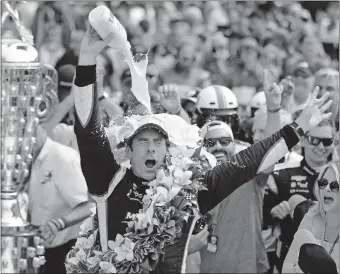  ??  ?? Simon Pagenaud pours milk on his head after winning the Indianapol­is 500 on Sunday at Indianapol­is Motor Speedway. [AP PHOTO/DARRON CUMMINGS]