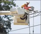  ?? Brian A. Pounds / Hearst Connecticu­t Media ?? A crew from O’Connell Electric in Buffalo, N.Y., restores power on Tavern Rock Road in Stratford on Aug. 9.