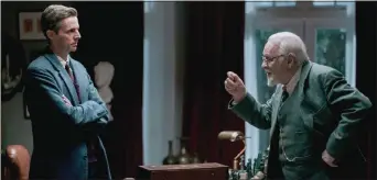  ?? COURTESY OF SABRINA LANTOS ?? Atheist and pioneering psychoanal­yst Sigmund Freud (Anthony Hopkins, right) chats with author and former atheist C.S. Lewis (Matthew Goode) in “Freud’s Last Session,” a film from director and co-writer Matthew Brown.