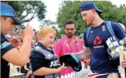  ??  ?? England all-rounder Ben Stokes obliges a young fan.