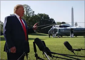  ?? EVAN VUCCI - ASSOCIATED PRESS ?? President Donald Trump talks with reporters before departing for an event to celebrate the 400th anniversar­y celebratio­n of the first representa­tive assembly at Jamestown, on the South Lawn of the White House on Tuesday in Washington.