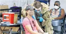  ?? JOE BURBANK/ORLANDO SENTINEL ?? Central Floridians continue to receive COVID-19 vaccinatio­ns at the FEMAsuppor­ted vaccinatio­n site at Valencia College West campus on March 15.