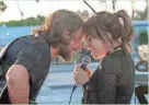  ?? NEAL PRESTON/WARNER BROS. ?? Jackson (Bradley Cooper, left) and Ally (Lady Gaga) share a song in “A Star Is Born.”