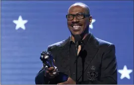  ??  ?? Eddie Murphy accepts the lifetime achievemen­t award at the 25th annual Critics’ Choice Awards in Santa Monica, Calif., on Jan. 12, 2020.