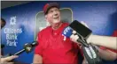  ?? CHARLES FOX — PHILADELPH­IA INQUIRER VIA AP ?? Phillies hitting coach Charlie Manuel discusses his new role in the dugout before a baseball game against the Chicago Cubs, Wednesday at Citizens Bank Park.