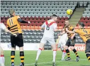  ??  ?? Close call Joe Gorman’s header hits the bar