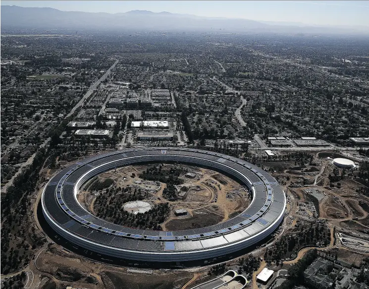  ?? JUSTIN SULLIVAN / GETTY IMAGES ?? Apple’s “spaceship” campus — dubbed “Apple Park” — is nearing completion in Cupertino, Calif. The $5-billion facility will house 13,000 employees in over 2.8 million square feet of office space. It’s time we considered the effects tech mega- companies like Apple, Google, Facebook and Amazon have on our individual­ity, Franklin Foer writes.