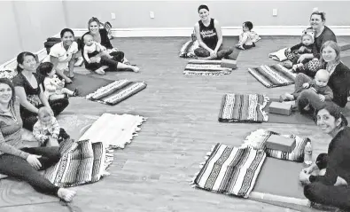  ??  ?? Modern Milk offers Mommy and Me yoga classes for moms and babies up to age 2.