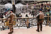  ?? Christophe Ena/Associated Press ?? Soldiers patrol inside the Gare de Lyon station after an attack Saturday in Paris. A man injured three people in the attack.