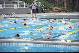  ??  ?? Last year’s triPATHlon athletes competed in a 400-yard swim at the Chastain Park pool.