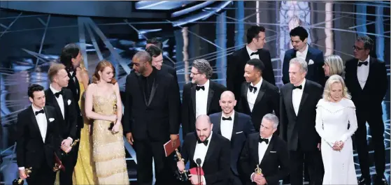  ?? Picture: Chris Pizzello/Invision/AP ?? CONTROVERS­Y: Jordan Horowitz, centre, and the cast of La La Land mistakenly accept the award for best picture at the Oscars at the Dolby Theatre in Los Angeles. It was later announced that Moonlight, was the winner for best picture.