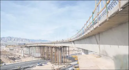  ?? Elizabeth Brumley Las Vegas Review-Journal ?? Constructi­on continues on the Centennial Bridge connecting U.S. Highway 95 northbound to the 215 Beltway westbound. The state’s second-longest bridge will stand as tall as 75 feet and stretch 2,635 feet.