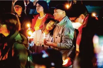  ?? Noah Berger/Special to The Chronicle ?? A January S.F. vigil honors the victims of mass shootings in Half Moon Bay and Monterey Park (Los Angeles County). A weekend town hall meeting in San Jose explored the impact of attacks.