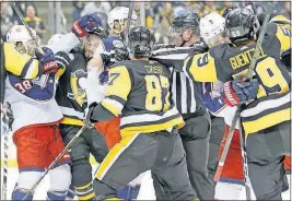  ?? PRESS] [KEITH SRAKOCIC/THE ASSOCIATED ?? The Penguins’ Jake Guentzel (59) and Sidney Crosby (87) fight with the Blue Jackets’ Boone Jenner, left, Seth Jones, center, and Artemi Panarin as time expires in the second period.