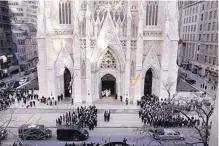  ?? MARK LENNIHAN/ASSOCIATED PRESS ?? NYPD Detective Steven McDonald ‘s casket arrives at St. Patrick’s Cathedral for his funeral Friday in New York. McDonald died on Tuesday, 30 years after a robbery suspect shot him in Central Park.