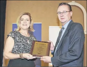  ?? HARRY SULLIVAN – TRURO DAILY NEWS ?? Michelle Bursey, left, presents the BDC Business Person of the Year Award to Chris Rovers, who accepted the award on behalf of his father, Leo Rovers, of L & R Constructi­on in Stewiacke. In the right photo, Darrell Kuhn, left, president and CEO of...