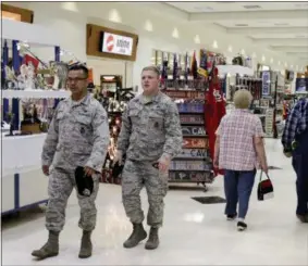  ?? NATI HARNIK — THE ASSOCIATED PRESS ?? In this May 24, 2017, photo, members of the military and civilians with shopping privileges walk among stores at the Exchange, at Offutt Air Force Base, Neb. Starting in fall 2017, all honorably discharged veterans will be eligible to shop tax-free...