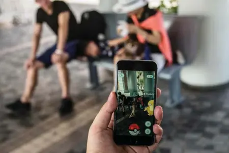  ?? LAM YIK FEI/GETTY IMAGES FILE PHOTO ?? A wave of copycat experience­s didn’t follow Pokemon Go’s wild popularity, but it generated a surge of interest in augmented reality from tech giants.