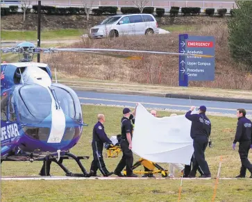  ?? Christian Abraham / Hearst Connecticu­t Media ?? A Life Star helicopter crew prepares to transport Fotis Dulos to New York from UConn Health in Farmington on Tuesday.