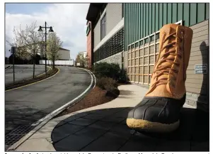  ?? (AP) ?? An oversize boot stands outside an L.L. Bean store in Dedham, Mass. L.L. Bean’s new agreement with retailers is a push to get more of its products in front of consumers.