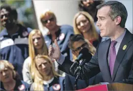  ?? Marcus Yam Los Angeles Times ?? MAYOR Eric Garcetti announces the approval of a host contract Friday for the 2028 Games. Technology, and potential threats, have changed since 1984.