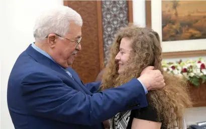  ?? Reuters ?? palestinia­n president Mahmoud Abbas meets with palestinia­n teenager Ahed tamimi after she was released from an Israeli prison, in ramallah in the occupied West Bank on Sunday. —