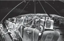  ?? PHOTOS PROVIDED TO CHINA DAILY ?? Top: Actress Wang Xiaohuan (left) and an audience member interact with each other onstage. Above: Old items are placed on all 300 seats of the theater to remind audience members of their childhoods.