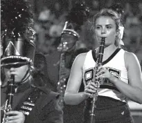  ??  ?? Junior Taylor Barnes plays the clarinet with the Rabbit Band. She is also a cheerleade­r.